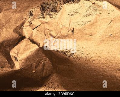 Bronze foil texture with crumpled, creased metal surface. Warm, rich pattern with golden shimmer and dark shadows for a vintage, industrial feel. Shin Stock Photo