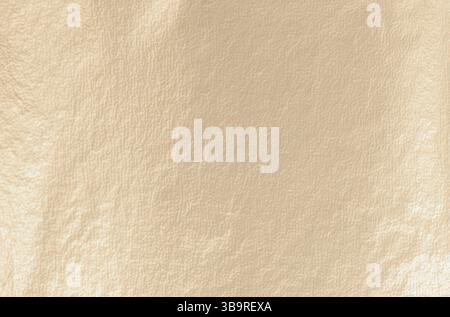 Gold leaf background with a smooth, matte texture. Soft gold, antique design with glistering gold foil and metallic shine. Subtle, refined finish, cre Stock Photo
