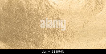 Gold metallic foil background with a smooth, shiny surface. Elegant, refined design in warm yellow tones, featuring a subtle shimmer and gradient. Pre Stock Photo