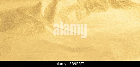 Gold metallic foil texture with a crumpled, smooth surface. Shiny, bright material in warm yellow tones, featuring an elegant gradient and subtle shim Stock Photo