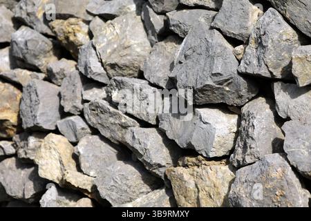 Natural stone wall made of large stones Stock Photo