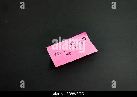 Pink notes with a writing that says you can do it Stock Photo