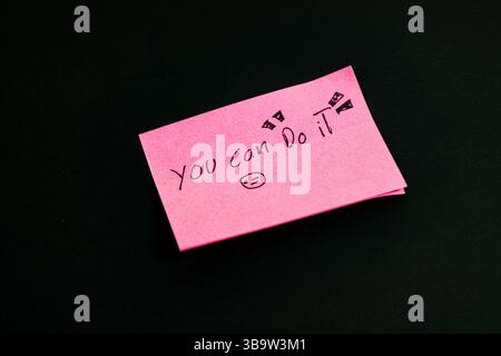 Pink notes with a writing that says you can do it Stock Photo