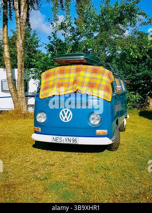 Blue Campervan on a countryside campsite Stock Photo - Alamy