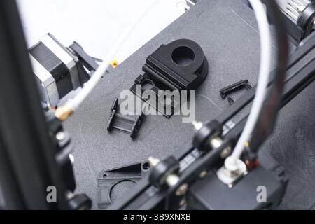 3D printer nozzle assembly. Close-up view of extruder components. Technical setup of 3D printing head. High precision machine part. Mechanical struct Stock Photo