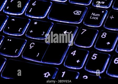 Close up of the enter key. Selective focus of the intro key on the laptop keyboard Stock Photo