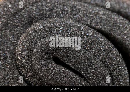 soft foam of black color for safe packaging of objects and products, foamy soft foam for giving elasticity to objects or sound insulation or as a pack Stock Photo