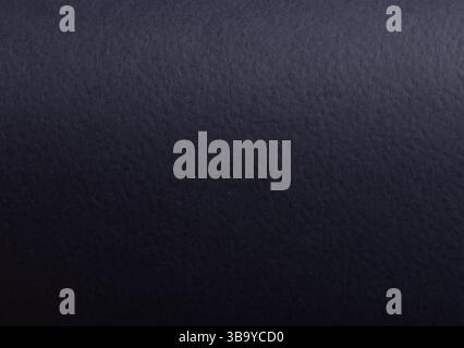 Paper texture with dark blue tone, clean matte surface and perforated overlay, premium designer paper creating elegant stylish backdrop with minimalis Stock Photo