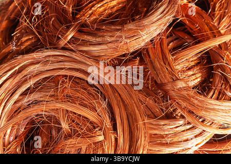 Scrap copper stripped cables twisted and collected in a heap, close-up. Stock Photo
