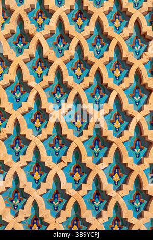 Traditional Moroccan zellij tiles creating an ornate pattern with vibrant colors Stock Photo