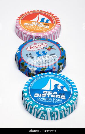 Three Tins of Sea Sisters Brand  British Conservas Seafood on a white background Stock Photo