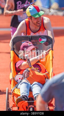 Comedians Rosie Jones and Ivo Graham cross the finish line during the