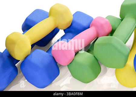 Group of dumbbells of different colors, shapes and sizes, isolated on white background Stock Photo