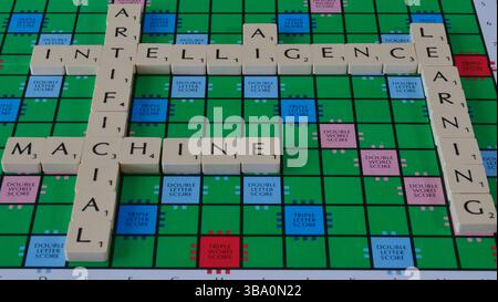 The concept of AI is illustrated on a Scrabble board with the words Robot, Machine, Learning, Artificial Intelligence spelled out in letters Stock Photo