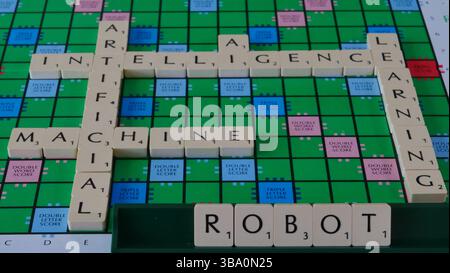 The concept of AI is illustrated on a Scrabble board with the words Robot, Machine, Learning, Artificial Intelligence spelled out in letters Stock Photo