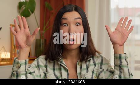 Portrait Asian Korean Chinese Japanese woman make mind explosion gesture female girl businesswoman wife housewife home indoor difficulties problem Stock Photo