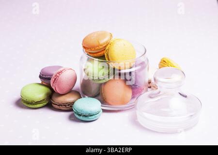 Colorful macaroons - french dessert in a glass jar Stock Photo