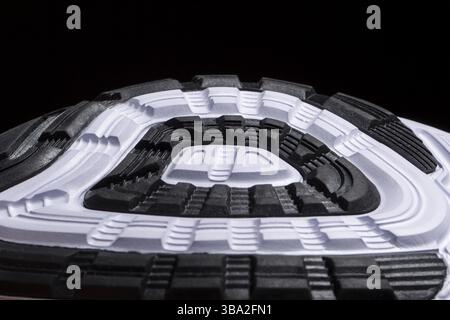 Fragment of a rubber black and white sole of a sneaker. Bottom of sports shoes Stock Photo