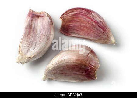 Top view on three purple garlic cloves isolated (with shadows) on white background Stock Photo