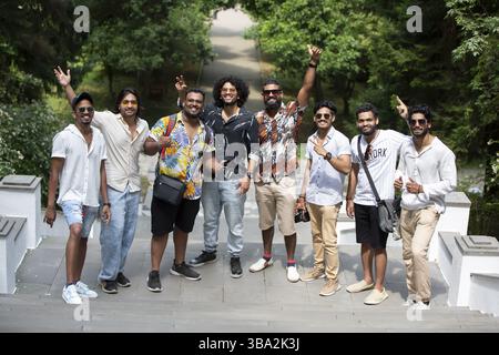 August 05, 2022. Georgia. Chakvi village. Batonic garden. A group of Indian students. Young modern Indian men pose, enjoy life, jump up Stock Photo