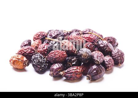 A pile berries of dried rosehips isolated on white Stock Photo