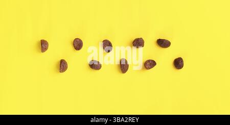 Top down view, chocolate cornflakes on yellow board, Liptovsky Hradok, Slovakia, Europe Stock Photo