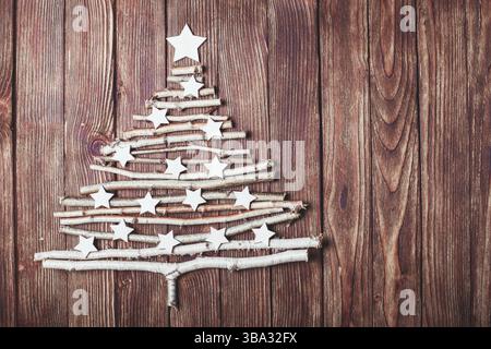 Birch branches and white stars in a shape of christmas tree Stock Photo