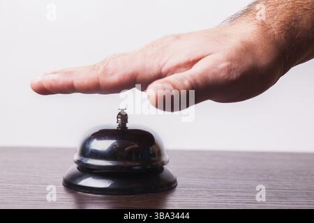 Close-up finger that presses of the service bell ring Stock Photo