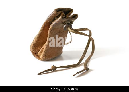 Old worn leather coin pouch isolated on white background, Liptovsky Hradok, Slovakia, Europe Stock Photo