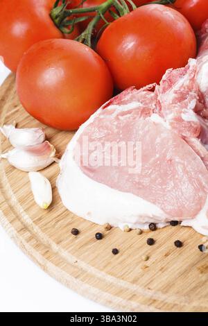 Raw loin slices on the board isolated on white Stock Photo