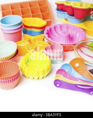 Rainbow silicone confectionery utensils on a white background Stock Photo