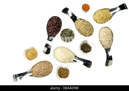 BEANS RICE BUCKWHEAT SEEDS LENTILS SPICES IN SPOONS ON THE ISOLATE Stock Photo