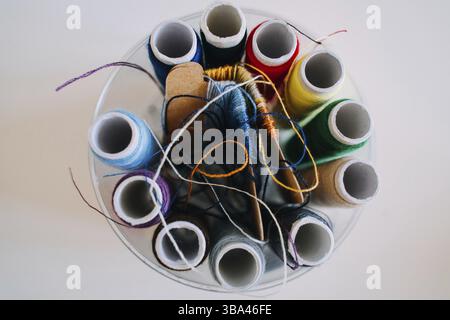 Macro color photo of different sewing materials. Tools and accessories on light neutral background. Top view. Flat lay composition Stock Photo