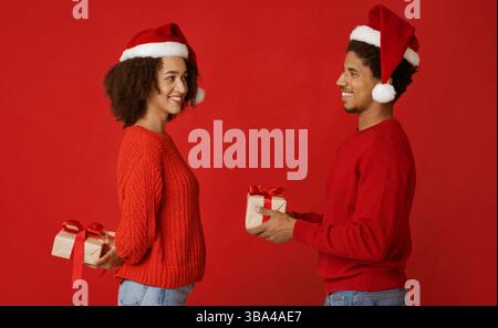 Couple in love exchanging New Year presents Stock Photo