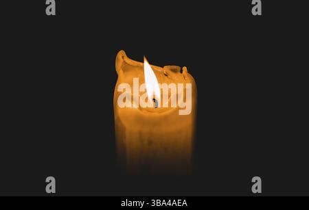 One light candle burning brightly with black background Stock Photo