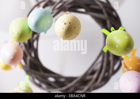 Easter wreath with color eggs on ribbons Stock Photo