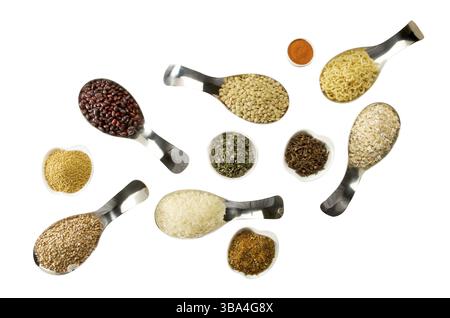 BEANS RICE BUCKWHEAT SEEDS LENTILS SPICES IN SPOONS ON THE ISOLATE Stock Photo