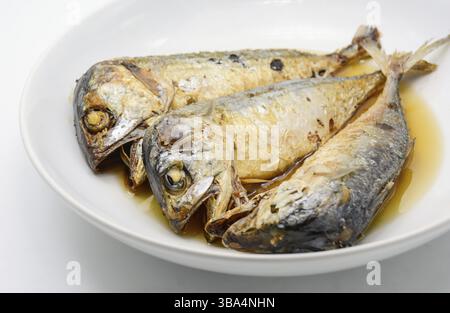 Fried mackerel on white plate. Deep fried fish Stock Photo