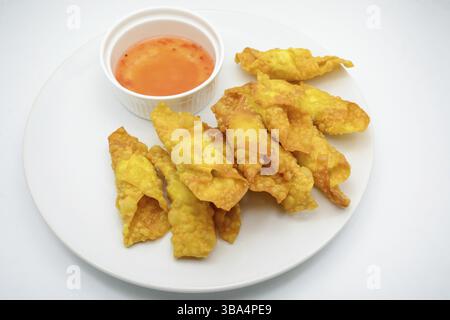 Deep Fried Won ton on white plate with dip source Stock Photo