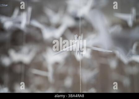 White Origami cranes paper closeup swarm macro photo Stock Photo