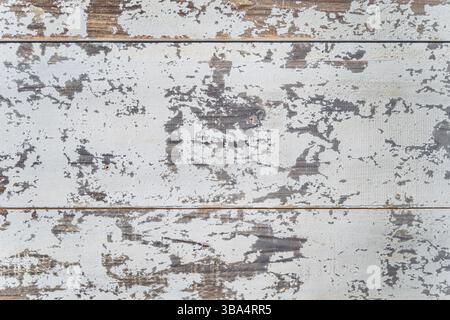 Vintage white painted oak, scratched, aged and paint peeling off from wood. High quality texture and background for your projects and creative work Stock Photo