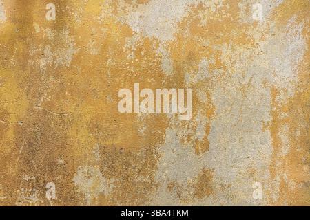 Old, grunge yellow cement, concrete or plaster wall with patterns and cracks. High quality texture and background for your projects and creative work Stock Photo