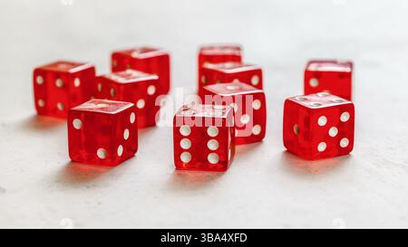 Red craps dices on white board showing different numbers, Liptovsky Hradok, Slovakia, Europe Stock Photo