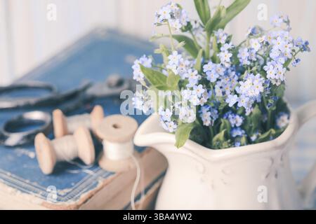Vintage still life with forget-me-not in a jug Stock Photo