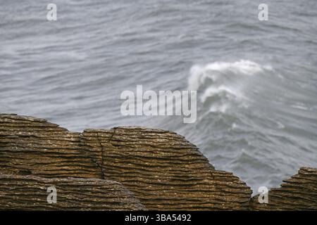 background of Limestone rocks and ocean waves at Punakaiki, New Zealand Stock Photo