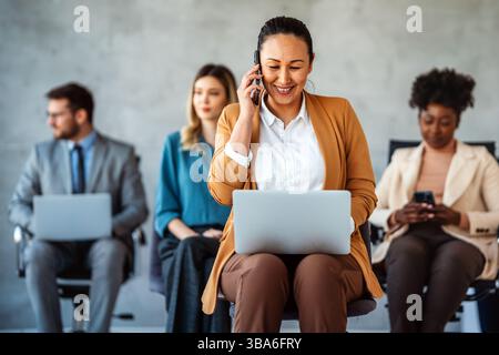 Happy professional business woman company employee, young entrepreneur smiling businesswoman working Stock Photo