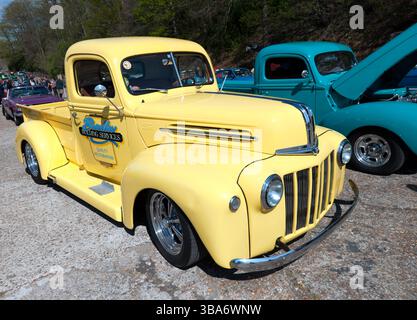 Three-quarters Front View a Custom Built, 1946, Yellow, Ford  Pickup Truck on display at the Brooklands Museum during the Easter Classic Gathering Stock Photo