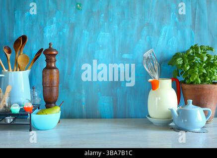 various vintage kitchen utensils on kitchen table with free copy space Stock Photo