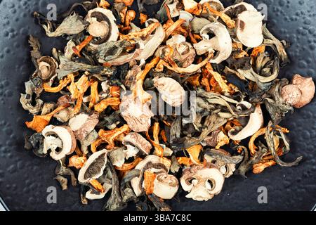 Various dried mushrooms. Pile of dried mushroom. Close up. Stock Photo
