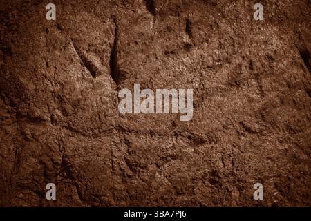Brown rocky surface texture. Brown natural stone mountain background. Stock Photo